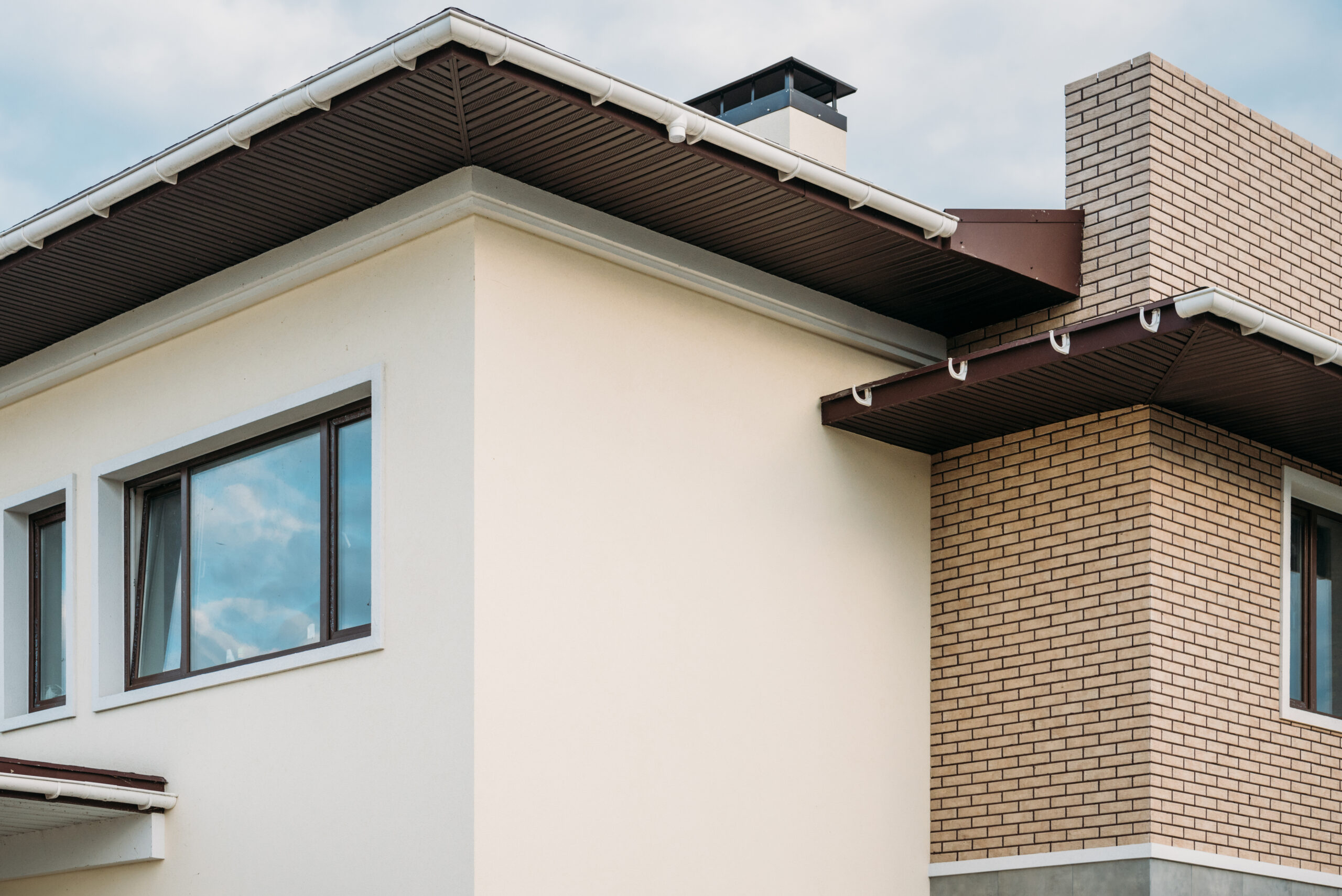 partial view of newly constructed building under cloudy sky